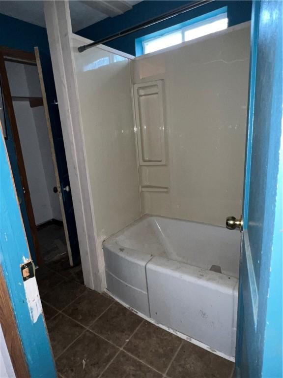 1010 S Jones St, Robinson, IL 62454 - bathroom with tile patterned floors and bathtub / shower combination
