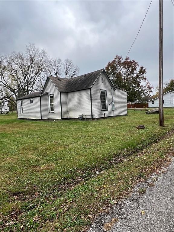 1010 S Jones St, Robinson, IL 62454 - view of side of property with a lawn
