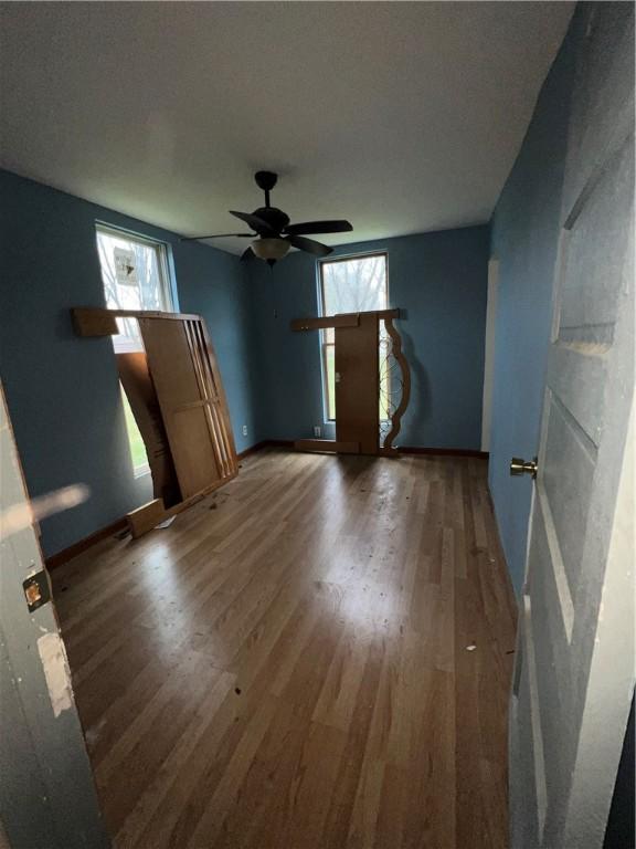 1010 S Jones St, Robinson, IL 62454 - unfurnished room featuring hardwood / wood-style flooring, ceiling fan, and a textured ceiling