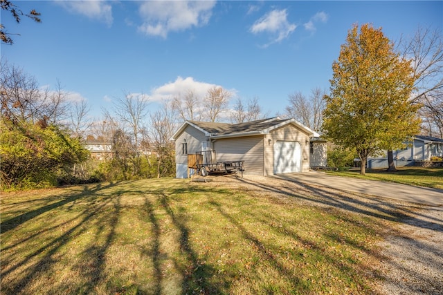 view of home's exterior featuring a yard and a garage