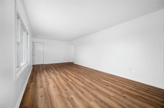 710 E Blackburn St, Paris, IL 61944 - unfurnished bedroom featuring light wood finished floors and baseboards