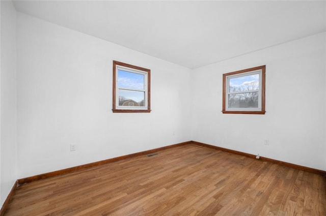 710 E Blackburn St, Paris, IL 61944 - unfurnished room with baseboards and light wood-style floors
