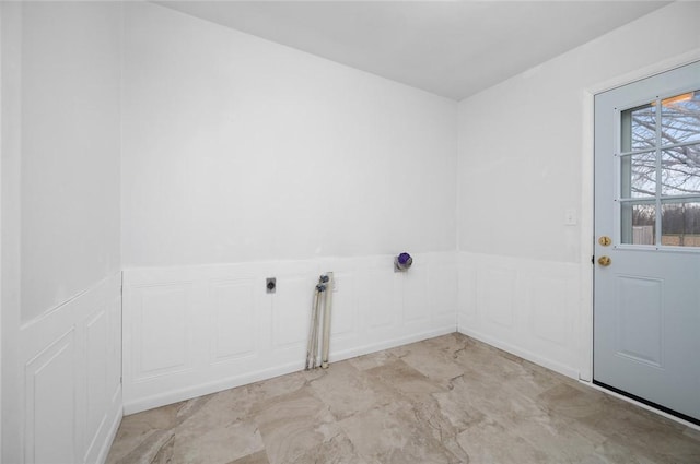 710 E Blackburn St, Paris, IL 61944 - laundry room featuring a decorative wall and wainscoting