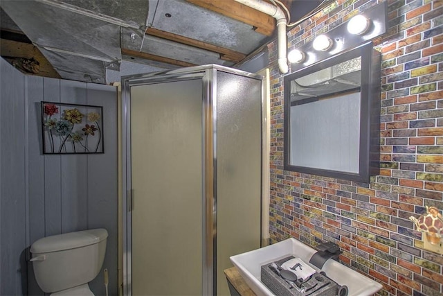 2921 Wasson Way, Decatur, IL 62521 - bathroom featuring a stall shower and brick wall