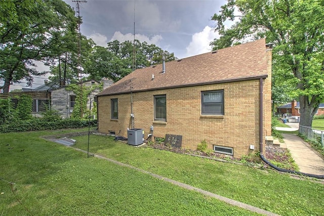2921 Wasson Way, Decatur, IL 62521 - back of house with brick siding and a shingled roof