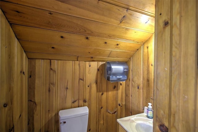 2921 Wasson Way, Decatur, IL 62521 - bathroom featuring wooden walls, wood ceiling, and vanity