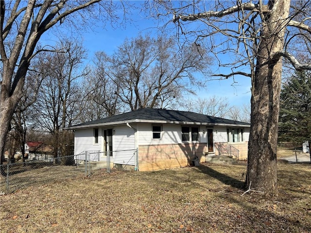 view of side of home featuring fence