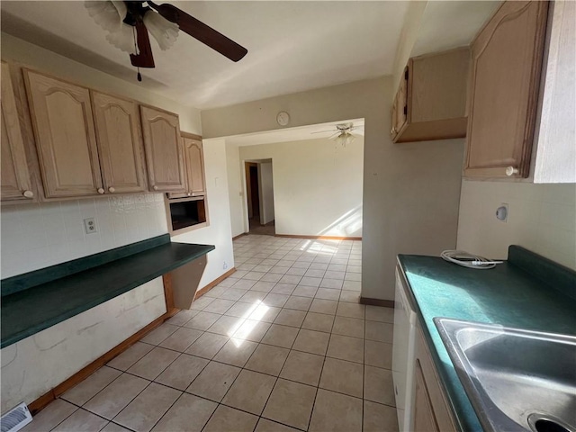 kitchen with light tile patterned floors, a ceiling fan, visible vents, dark countertops, and tasteful backsplash