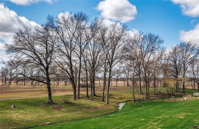 view of property's community with a lawn