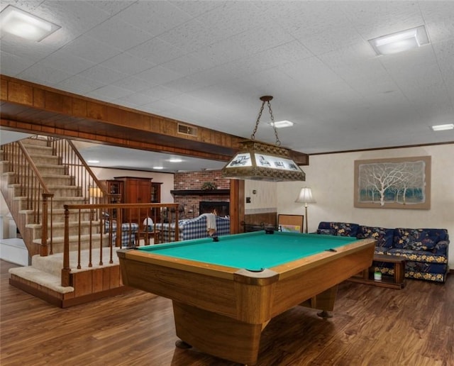 rec room featuring a fireplace, wood finished floors, visible vents, and billiards