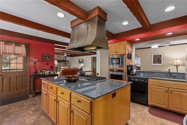 kitchen with dark stone countertops, stainless steel appliances, beamed ceiling, a kitchen island, and ceiling fan