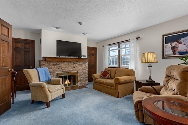 carpeted living room featuring a textured ceiling and a stone fireplace