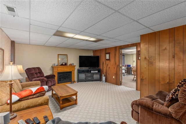 9769 Loy Chapel Rd, Effingham, IL 62401 - carpeted living area with a drop ceiling, wooden walls, and a fireplace