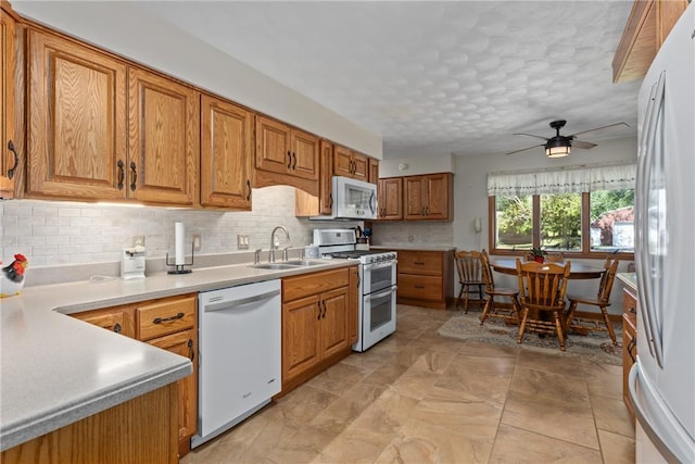 9769 Loy Chapel Rd, Effingham, IL 62401 - kitchen with appliances with stainless steel finishes, a sink, ceiling fan, backsplash, and a textured ceiling