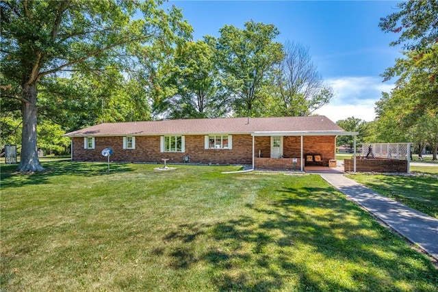 9769 Loy Chapel Rd, Effingham, IL 62401 - ranch-style house with a front lawn, an attached carport, brick siding, and driveway