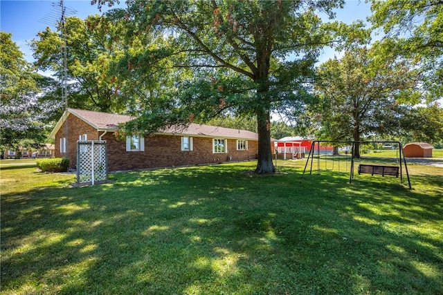9769 Loy Chapel Rd, Effingham, IL 62401 - view of green lawn with a playground