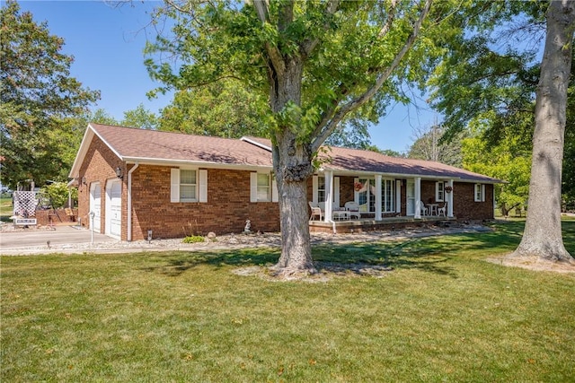 9769 Loy Chapel Rd, Effingham, IL 62401 - single story home featuring a porch, brick siding, a front lawn, and an attached garage