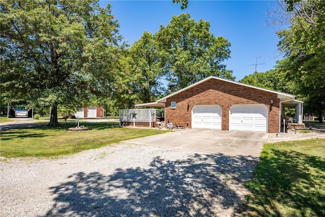 9769 Loy Chapel Rd, Effingham, IL 62401 - view of front of house with concrete driveway, a front lawn, brick siding, and an outdoor structure
