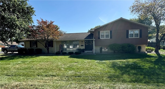 tri-level home featuring a front yard