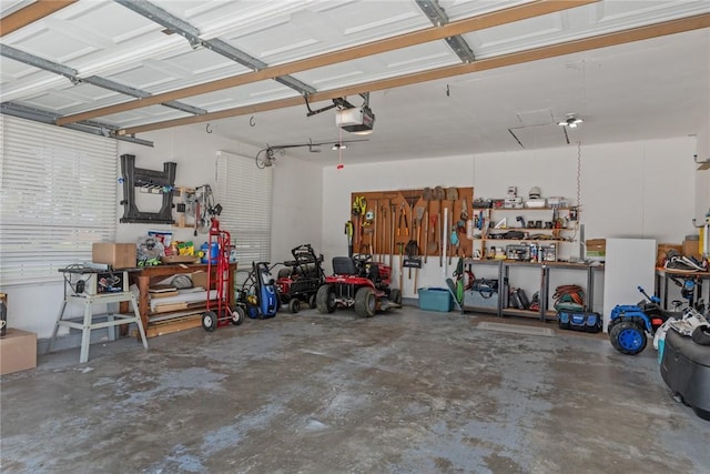 100 Pine Dr, Effingham, IL 62401 - garage with a workshop area and a garage door opener