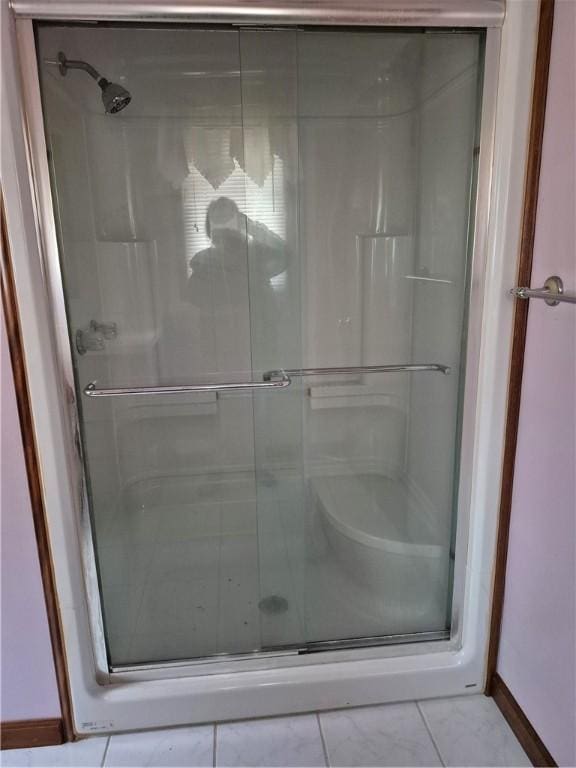 910 Glendale Ave, Tilton, IL 61833 - bathroom featuring tile patterned flooring and a shower with door