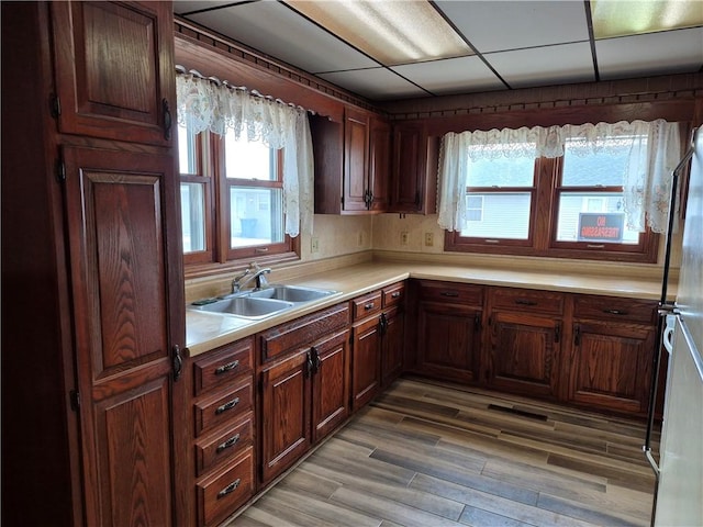 910 Glendale Ave, Tilton, IL 61833 - kitchen featuring sink, wood-type flooring, and fridge