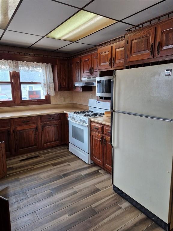 910 Glendale Ave, Tilton, IL 61833 - kitchen featuring hardwood / wood-style floors and white appliances