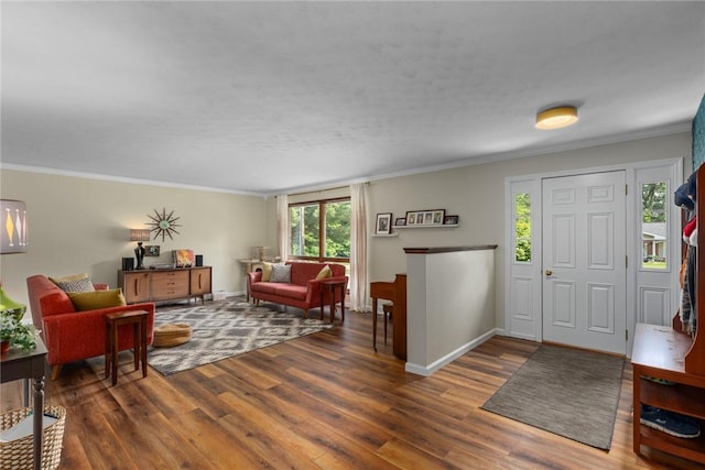 106 E Hawthorne Dr, Effingham, IL 62401 - entryway featuring wood finished floors, ornamental molding, and baseboards