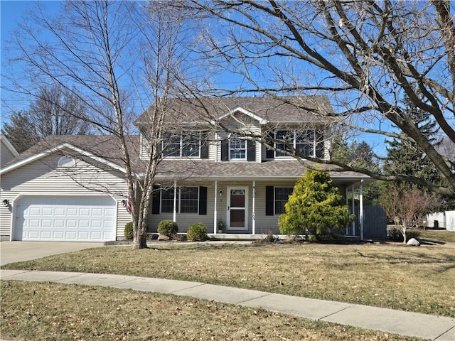 view of front of home featuring concrete driveway, an attached garage, and a front yard