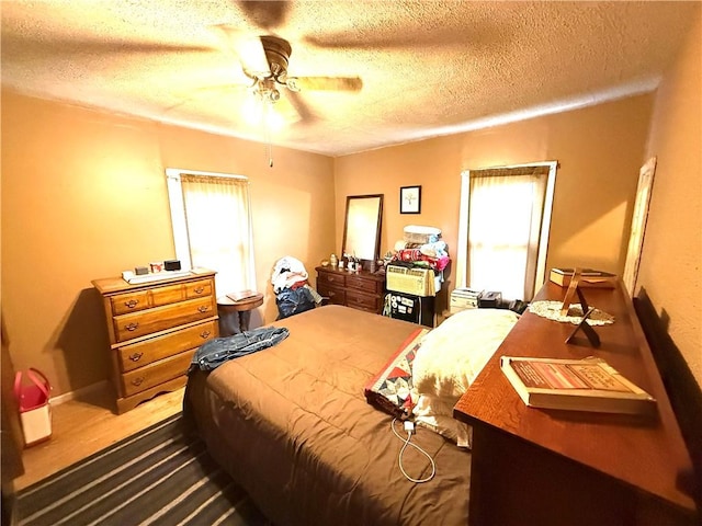1953 E 4200 N Rd, Rankin, IL 60960 - bedroom featuring a textured ceiling and a ceiling fan
