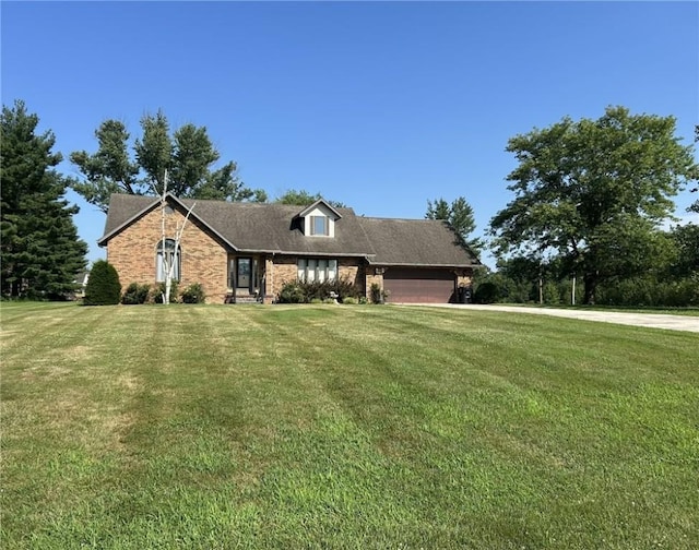 16142 Country Estates Rd, Effingham, IL 62401 - view of front of house featuring a front yard, a garage, brick siding, and driveway