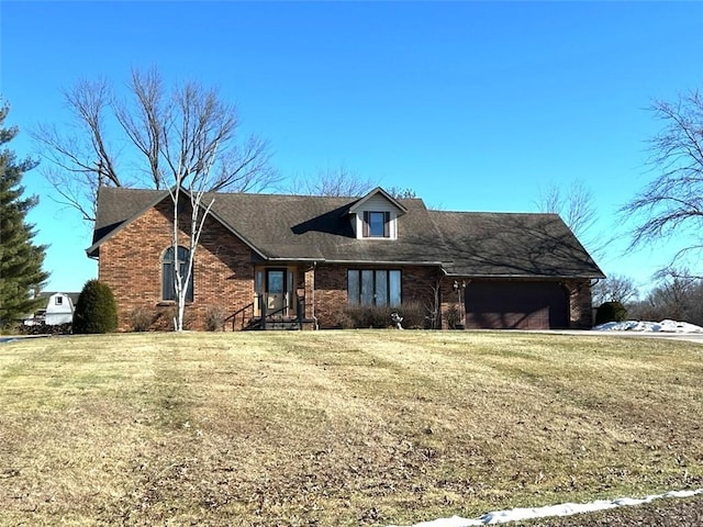 view of front of property with a garage and a front yard