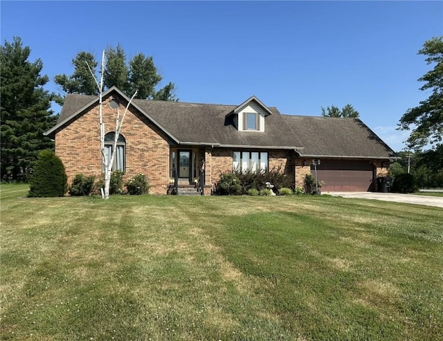 16142 Country Estates Rd, Effingham, IL 62401 - view of front of home featuring brick siding, a front yard, and an attached garage