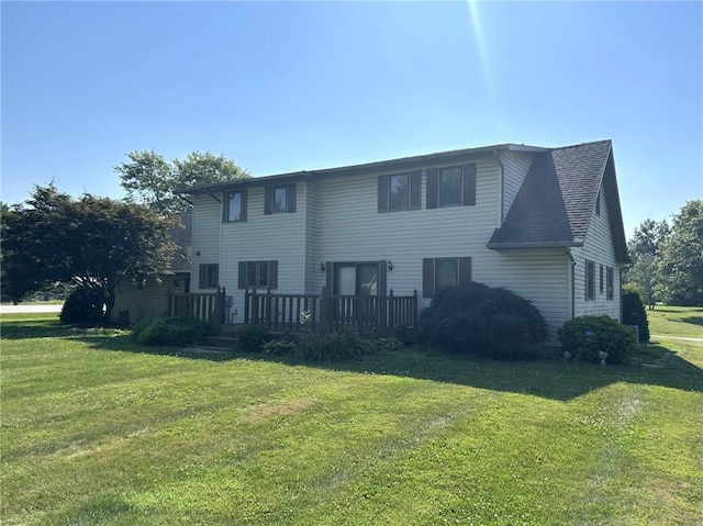 16142 Country Estates Rd, Effingham, IL 62401 - rear view of house featuring a deck and a lawn