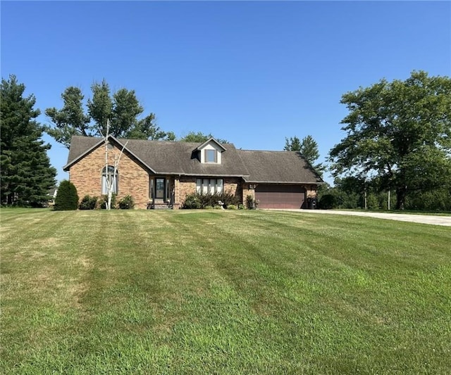 16142 Country Estates Rd, Effingham, IL 62401 - view of front facade with a front yard, a garage, and brick siding