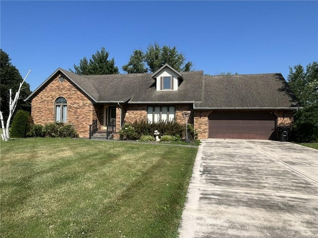 16142 Country Estates Rd, Effingham, IL 62401 - view of front of home featuring brick siding, an attached garage, a front lawn, and concrete driveway