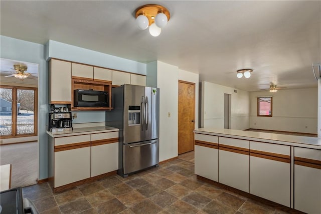 kitchen featuring stainless steel refrigerator with ice dispenser, white cabinets, and ceiling fan