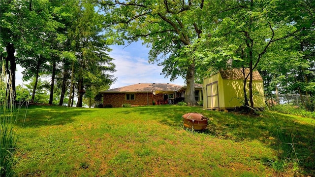 1950 Shore Oak Dr, Decatur, IL 62521 - view of green lawn with an outdoor structure