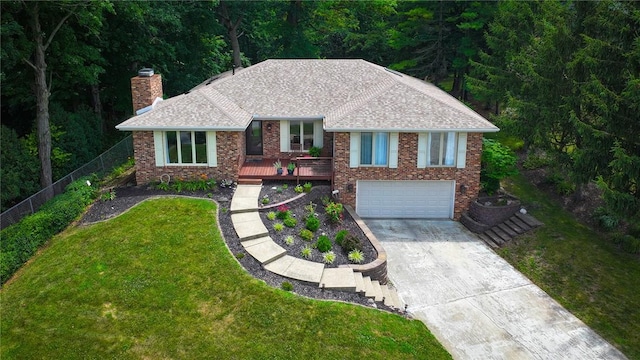 1950 Shore Oak Dr, Decatur, IL 62521 - single story home with driveway, a chimney, a garage, a wooden deck, and roof with shingles
