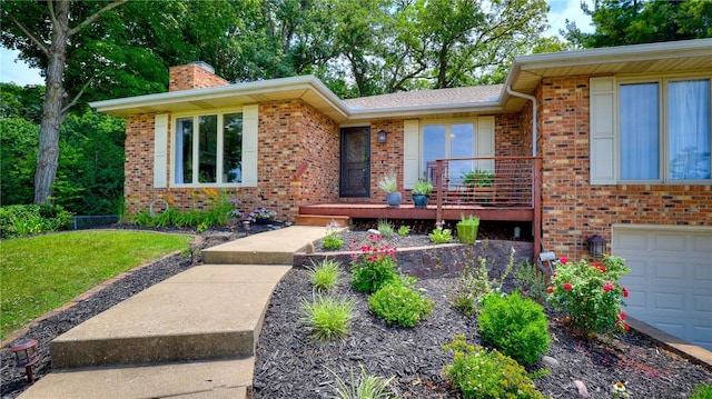 1950 Shore Oak Dr, Decatur, IL 62521 - view of front facade featuring a chimney, brick siding, an attached garage, and a front yard