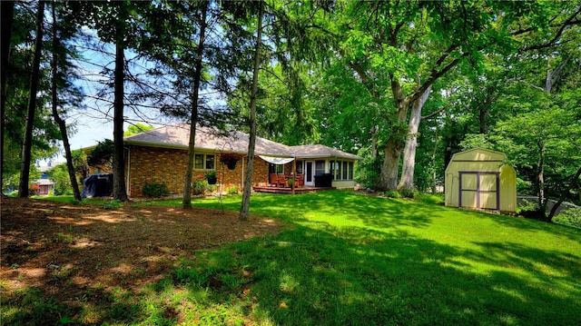 1950 Shore Oak Dr, Decatur, IL 62521 - view of grassy yard featuring a shed