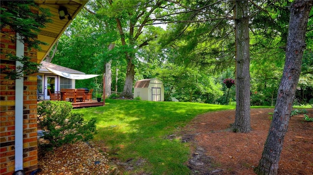 1950 Shore Oak Dr, Decatur, IL 62521 - view of grassy yard with a storage unit and a wooden deck