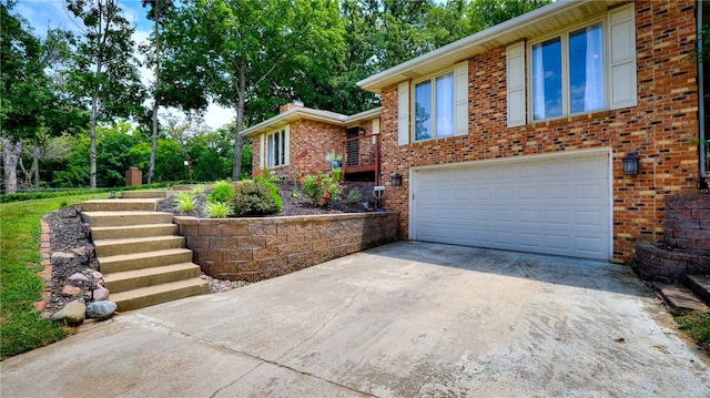 1950 Shore Oak Dr, Decatur, IL 62521 - view of front of home with driveway, an attached garage, and brick siding