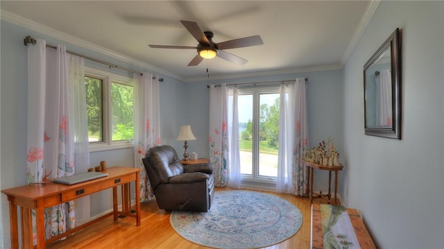 1950 Shore Oak Dr, Decatur, IL 62521 - living area featuring light wood-style floors, a ceiling fan, and ornamental molding