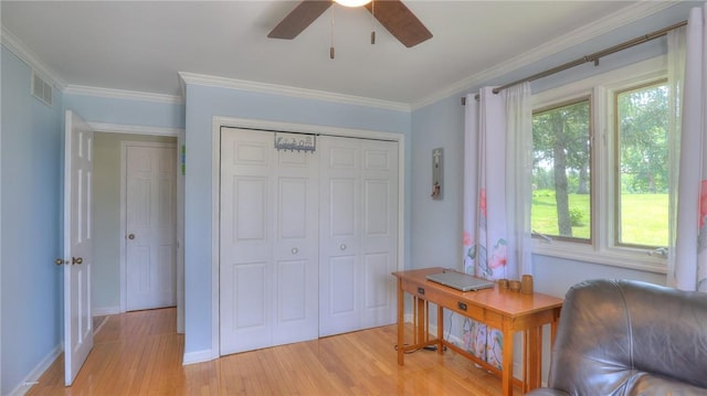 1950 Shore Oak Dr, Decatur, IL 62521 - sitting room featuring light wood-style floors, a ceiling fan, and ornamental molding