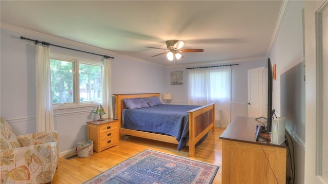 1950 Shore Oak Dr, Decatur, IL 62521 - bedroom featuring light wood-style flooring, ornamental molding, and ceiling fan