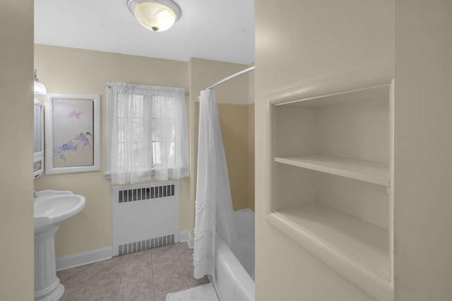 530 Powers Ln, Decatur, IL 62522 - bathroom featuring radiator, tile patterned floors, and shower / tub combo