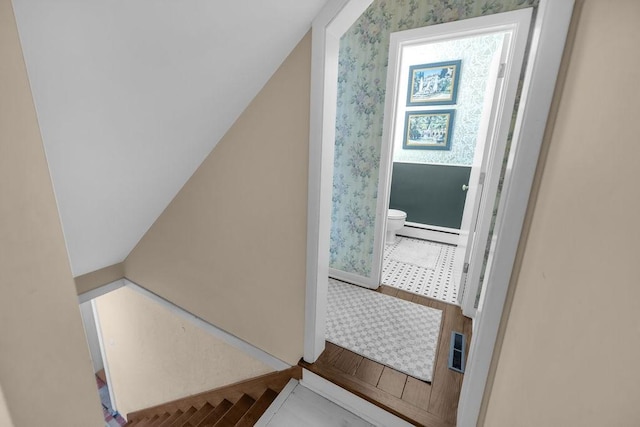 530 Powers Ln, Decatur, IL 62522 - stairway featuring a baseboard radiator and baseboards