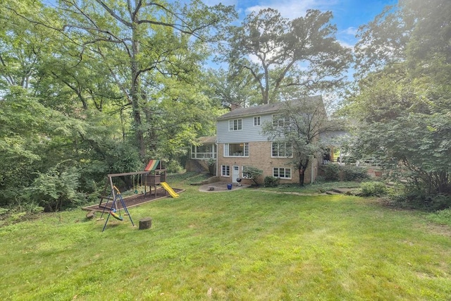 530 Powers Ln, Decatur, IL 62522 - view of grassy yard with a playground