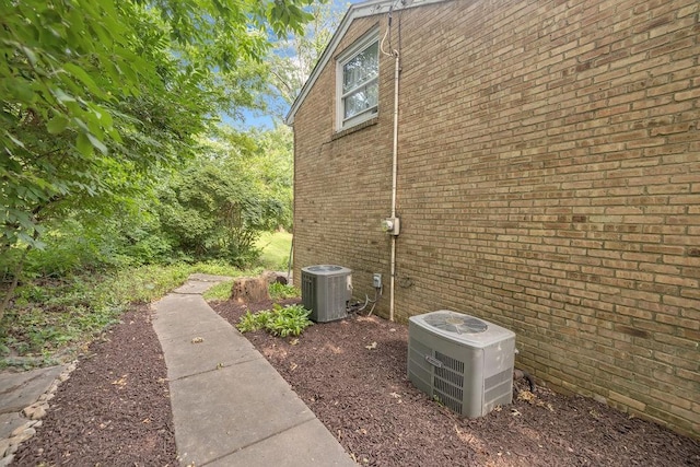 530 Powers Ln, Decatur, IL 62522 - view of property exterior with a central air condition unit and brick siding